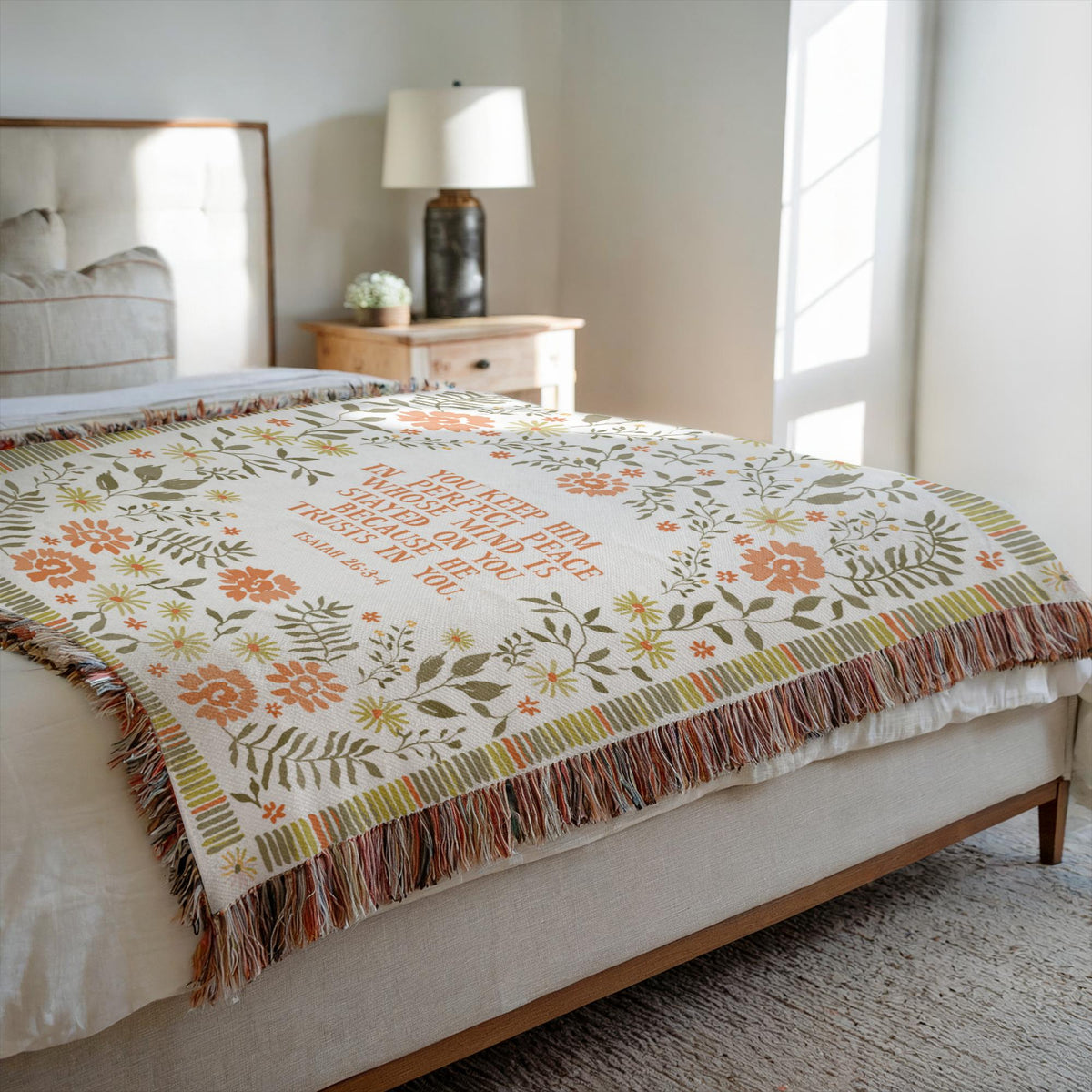 scripture blanket draped over a bed