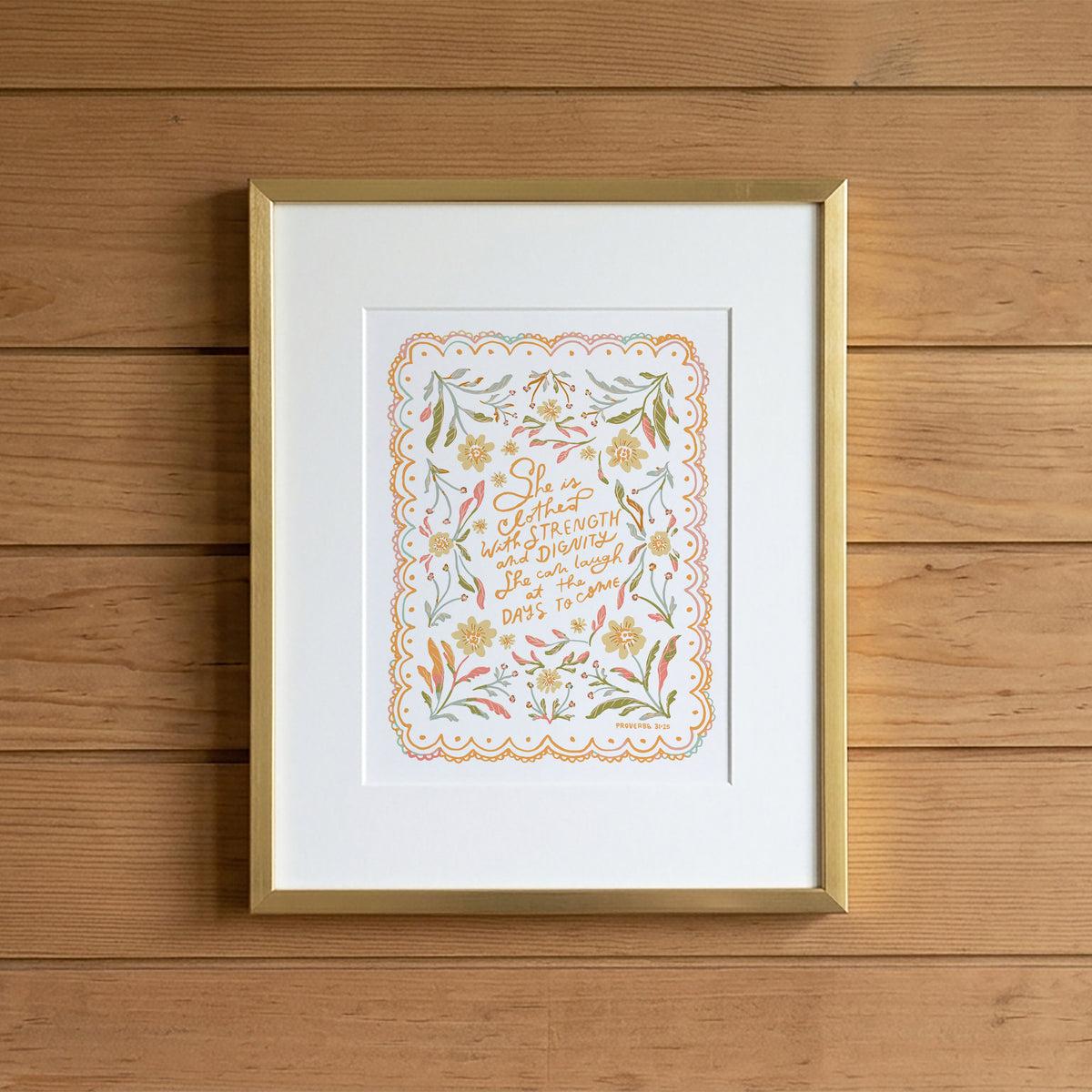 framed scripture print of proverbs 31 on a wood backdrop